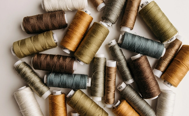 collection of different brown and grey colored strings.