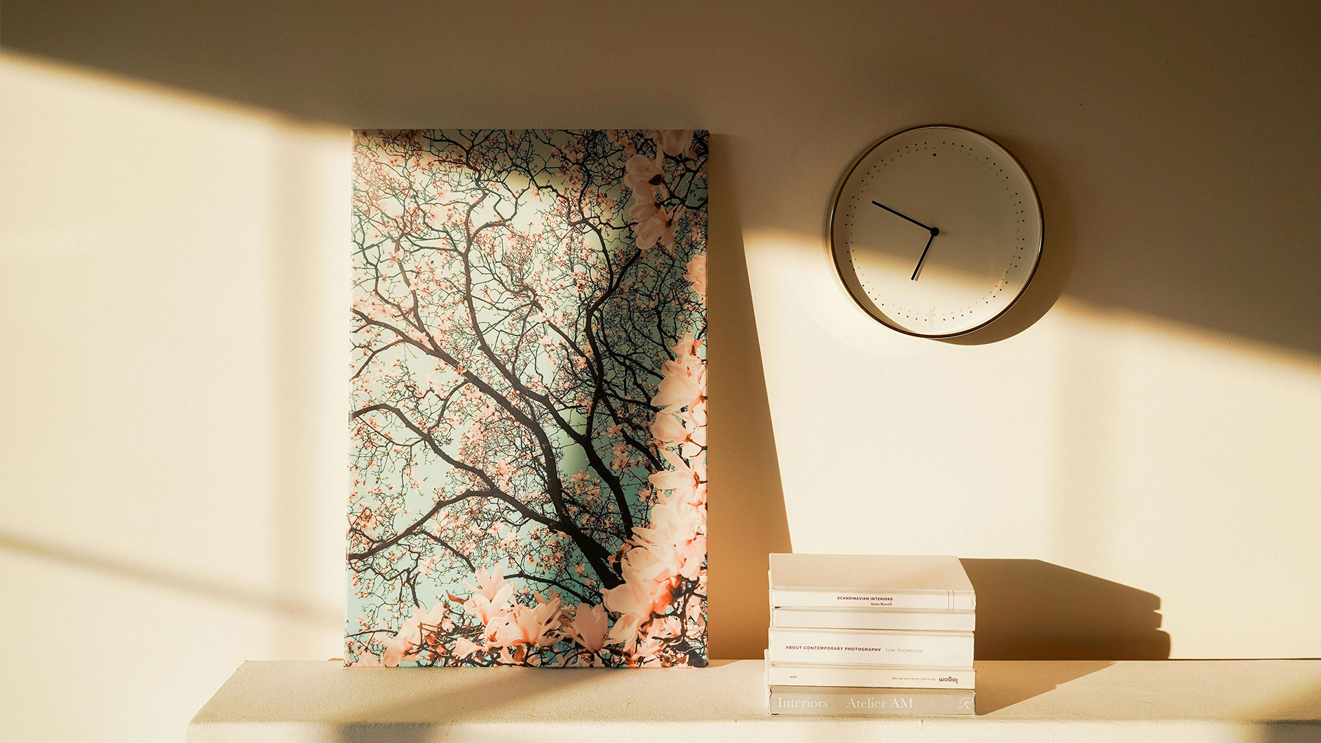 image of a clock and a painting leaned against a wall