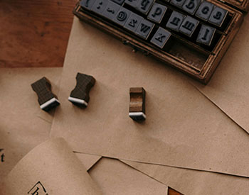 brown collection of wooden book stamps