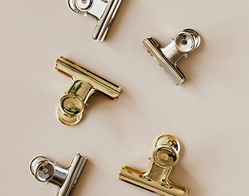 gold and silver binder clips collection image