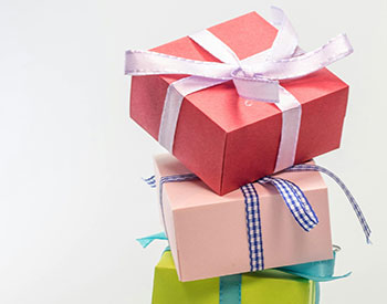 image of pink and green gift boxes stacked on top of each other