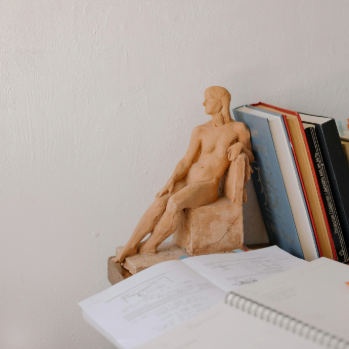 image of a wooden human shaped bookend