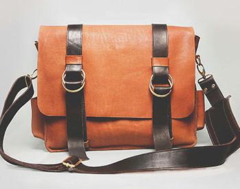 image of an orange overshoulder book bag