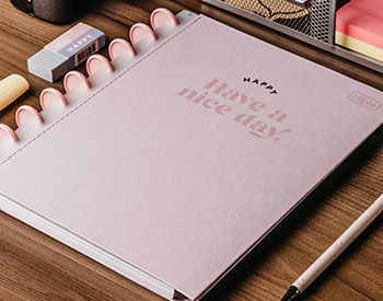 pink notebook that saids have a nice day