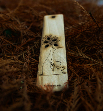 image of a wooden bookmark with a flower pattern